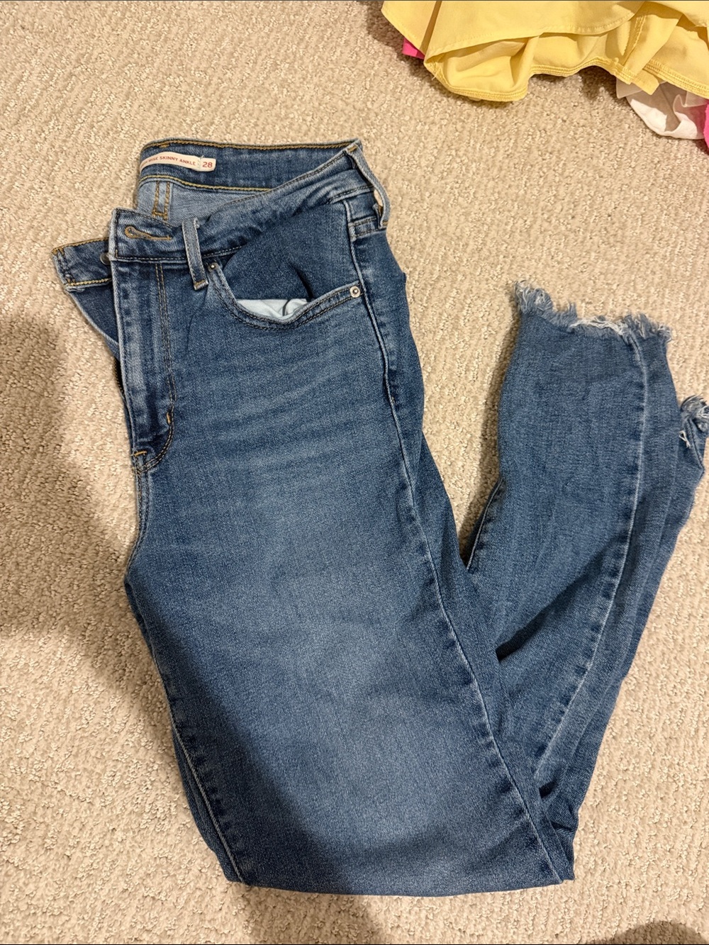 Levi's Women's Skinny Jeans in Medium Blue Wash with Frayed Hem